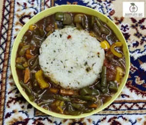 A bowl of Balanced Chinese-style rice with protein-rich Manchurian gravy.