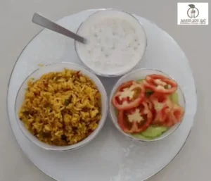 Fiber-rich tava pulav plate with 1 bowl of Raita and 1 bowl of salad slices