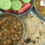 Indian Meal Plate with Salad, White Muttar ki Sabji and Dudhi Chana Dal Sabji and Roti