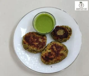 A plate showing Healthy paneer and veggie tikki with green protein rich dip.