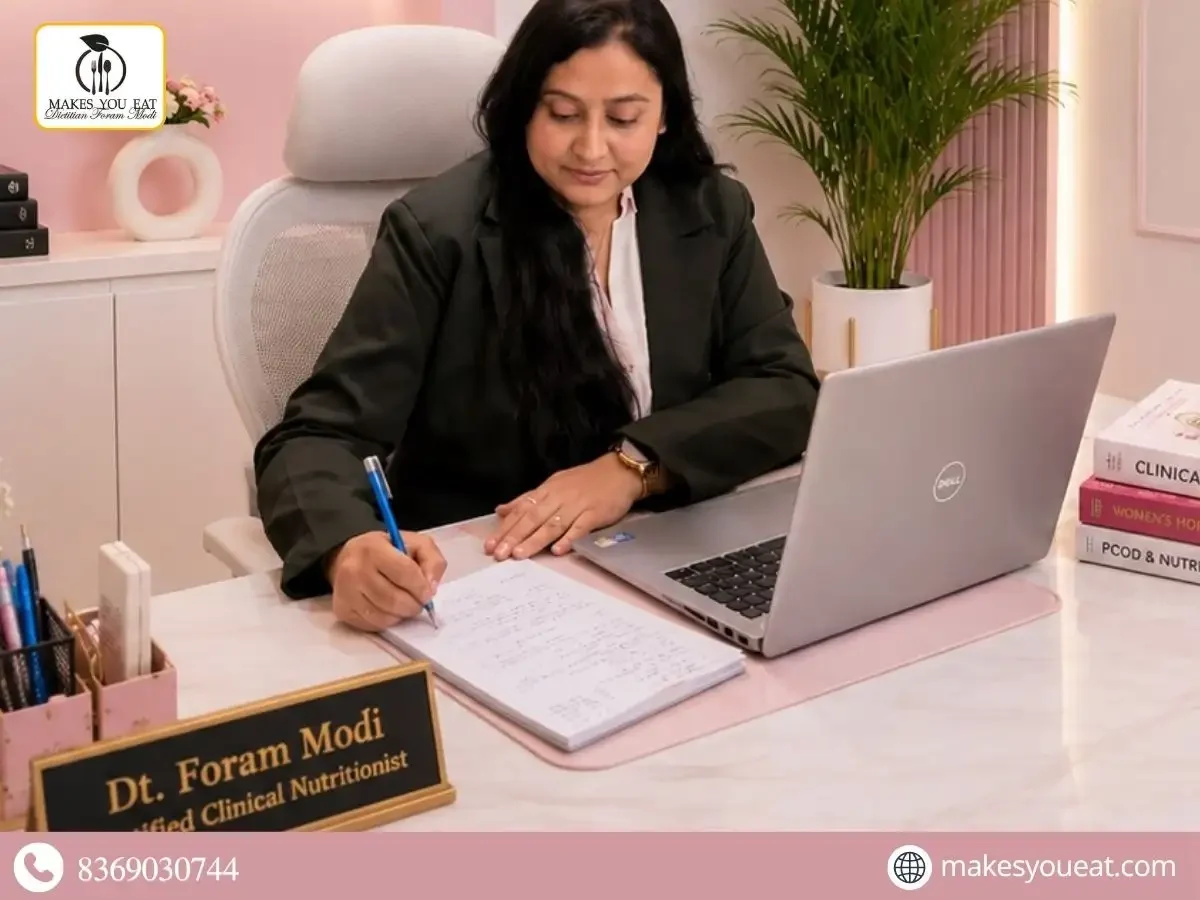 Dt. Foram Modi working in her office.