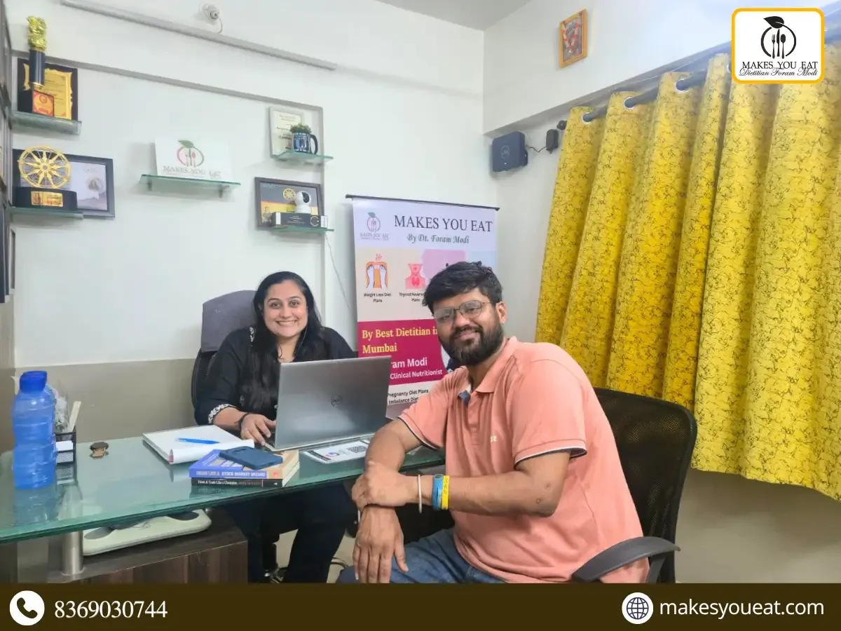 Dt. Foram Modi with Cholesterol patient at her diet clinic.