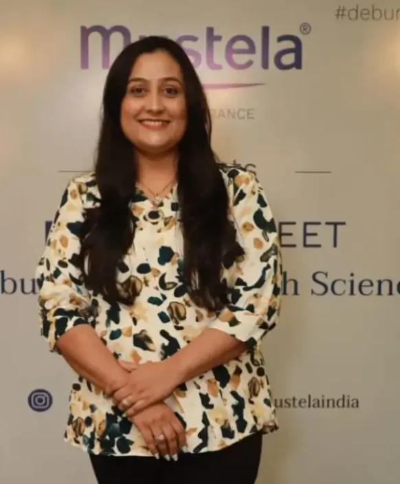 IBS Dietitian Posing on Stage for a Photo.