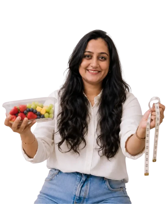 Dt. Foram Modi holding diet bowl and measuring tape.