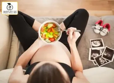 Pregnant women eating food.