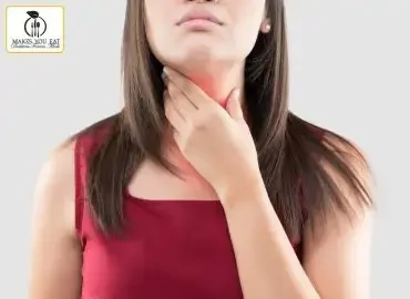 Women holding her thyroid gland in neck.