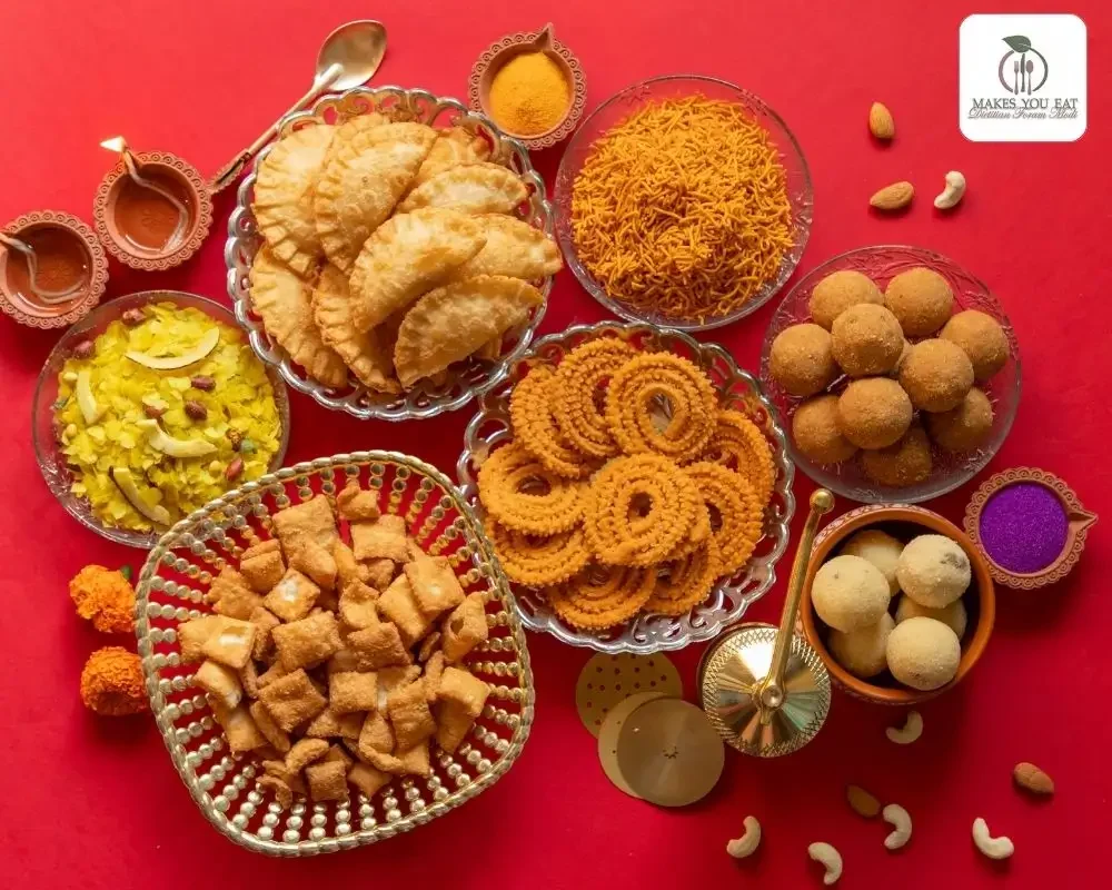 Set of Diwali Dish Items with Chakli, Karanji, Laddoo in bowls.
